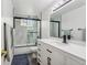 Modern bathroom with a black framed glass shower door, and an elegant vanity at 17391 E Weaver Ave, Aurora, CO 80016