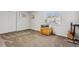 Carpeted bedroom featuring a window, closet and cartoon-themed storage chest at 17391 E Weaver Ave, Aurora, CO 80016