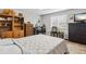 Comfortable bedroom with built-in shelving, and a large window with blinds at 17391 E Weaver Ave, Aurora, CO 80016