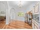 Elegant dining room with hardwood floors, chandelier, and archway to living room at 17391 E Weaver Ave, Aurora, CO 80016