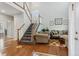 Bright entryway features hardwood floors, staircase, and soaring ceilings at 17391 E Weaver Ave, Aurora, CO 80016