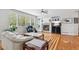 Bright living room with fireplace, large windows, and comfortable seating area at 17391 E Weaver Ave, Aurora, CO 80016