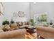 Cozy living room with hardwood floors, large window, and comfortable seating at 17391 E Weaver Ave, Aurora, CO 80016