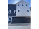 A modern home featuring blue siding and white accents, showcasing contemporary architectural design at 2140 S Haleyville Way, Aurora, CO 80018