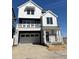 Charming two-story home featuring white siding, a balcony, and a two-car garage at 2140 S Haleyville Way, Aurora, CO 80018