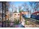 Fenced backyard with brick outbuilding and greenery at 4134 Bryant St, Denver, CO 80211