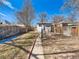 Long backyard view, fenced-in, features a white house and potential garden area at 4134 Bryant St, Denver, CO 80211
