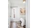 Cozy bedroom featuring natural light, neutral decor, and hardwood floors at 4134 Bryant St, Denver, CO 80211