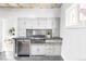 Bright kitchen features granite countertops, stainless steel appliances, and ample cabinet space at 4134 Bryant St, Denver, CO 80211