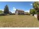 Spacious backyard with a lush lawn and privacy fence at 750 S Dearborn Ct, Aurora, CO 80012