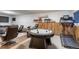 Finished basement with an air hockey table, treadmill, and lounge area at 750 S Dearborn Ct, Aurora, CO 80012