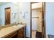 Functional bathroom featuring vanity, mirror, and access to shower stall at 750 S Dearborn Ct, Aurora, CO 80012