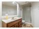 Bathroom featuring a glass-enclosed shower, marble vanity top, and classic fixtures at 750 S Dearborn Ct, Aurora, CO 80012