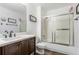 Well-lit bathroom with a bathtub-shower, vanity and modern fixtures at 750 S Dearborn Ct, Aurora, CO 80012