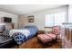 Spacious bedroom features traditional furnishings with a large window at 750 S Dearborn Ct, Aurora, CO 80012