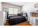 Neutral bedroom with built in closet, window and warm color palette at 750 S Dearborn Ct, Aurora, CO 80012
