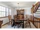 Traditional dining room featuring a grand wooden table and matching hutch, set beneath a chandelier at 750 S Dearborn Ct, Aurora, CO 80012