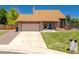 Charming home with manicured lawn, stone accents, and a large two-car garage at 750 S Dearborn Ct, Aurora, CO 80012