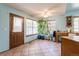 Bright kitchen nook with breakfast bar, tiled flooring, and large windows, perfect for enjoying a casual meal at 750 S Dearborn Ct, Aurora, CO 80012