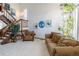 Bright living room boasts a grand staircase, tall ceilings and ample natural light from the many windows at 750 S Dearborn Ct, Aurora, CO 80012