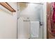 Clean and functional tiled shower with grab bars and glass door at 750 S Dearborn Ct, Aurora, CO 80012