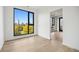 Bedroom features beautiful floors and a great city view at 1601 Park Ave # 506, Denver, CO 80218