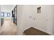 Hallway leading to the laundry room with modern washer and dryer hookups at 1601 Park Ave # 506, Denver, CO 80218