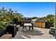 Outdoor roof deck with built-in barbecue and dining space at 1601 Park Ave # 506, Denver, CO 80218