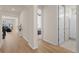 Hallway with hardwood floors and an open view of the home's layout at 2414 Leafdale Cir, Castle Rock, CO 80109