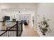 The staircase leads to a light-filled living space with a fireplace and modern furnishings at 2414 Leafdale Cir, Castle Rock, CO 80109