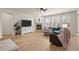 Cozy living room featuring a stone fireplace, ample natural light, and comfortable seating at 2414 Leafdale Cir, Castle Rock, CO 80109