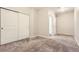 Bedroom with a large closet and neutral carpeting creating a serene and inviting space for relaxation at 4100 Albion St # 303, Denver, CO 80216