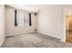 Cozy bedroom with a window and neutral carpeting providing a comfortable retreat for rest and relaxation at 4100 Albion St # 303, Denver, CO 80216