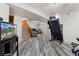 Finished basement with staircase, open floor plan and light gray wood-look flooring at 2292 Brantner Pl, Brighton, CO 80601