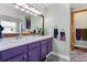 Bright Primary bathroom with double vanity, walk-in shower, decorative accents and neutral paint palette at 2292 Brantner Pl, Brighton, CO 80601