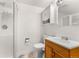 Well-lit bathroom with shower stall, vanity, sink, toilet and tile floor at 2292 Brantner Pl, Brighton, CO 80601