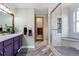 Bright bathroom with double vanity, walk-in shower, decorative accents and neutral paint palette at 2292 Brantner Pl, Brighton, CO 80601