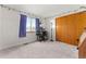 Bright bedroom with a large window, neutral walls, and a closet with wood sliding doors at 2292 Brantner Pl, Brighton, CO 80601