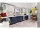Well-designed kitchen area with stainless steel appliances and a view of the adjacent dining space at 2292 Brantner Pl, Brighton, CO 80601
