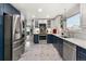 Bright and open kitchen showcasing stainless steel appliances, and modern countertops at 2292 Brantner Pl, Brighton, CO 80601