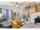 Inviting living room with vaulted ceilings, a ceiling fan, and a staircase at 2292 Brantner Pl, Brighton, CO 80601