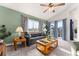 Comfortable living room with ample natural light, a ceiling fan, and a welcoming atmosphere at 2292 Brantner Pl, Brighton, CO 80601