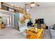 Inviting living room featuring high ceilings, a ceiling fan, and a cozy seating area at 2292 Brantner Pl, Brighton, CO 80601
