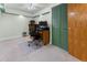 Bright office space with green trim, neutral walls, work desk, and a closet with bi-fold doors at 2292 Brantner Pl, Brighton, CO 80601