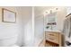 Updated bathroom features a subway tile shower and a modern vanity at 3246 S Stuart St, Denver, CO 80236