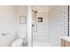 Clean bathroom featuring a white subway tile shower and modern fixtures at 3246 S Stuart St, Denver, CO 80236