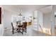 Cozy dining area with stylish chandelier, seamlessly connecting to the kitchen at 3246 S Stuart St, Denver, CO 80236