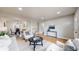 Bright living room featuring hardwood floors and neutral décor at 3246 S Stuart St, Denver, CO 80236