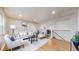 Bright living room featuring hardwood floors and neutral décor at 3246 S Stuart St, Denver, CO 80236