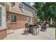 Inviting outdoor patio area with stylish seating, perfect for entertaining and relaxation, with a grill and lounge chair in the background at 4541 Christensen Cir, Littleton, CO 80123